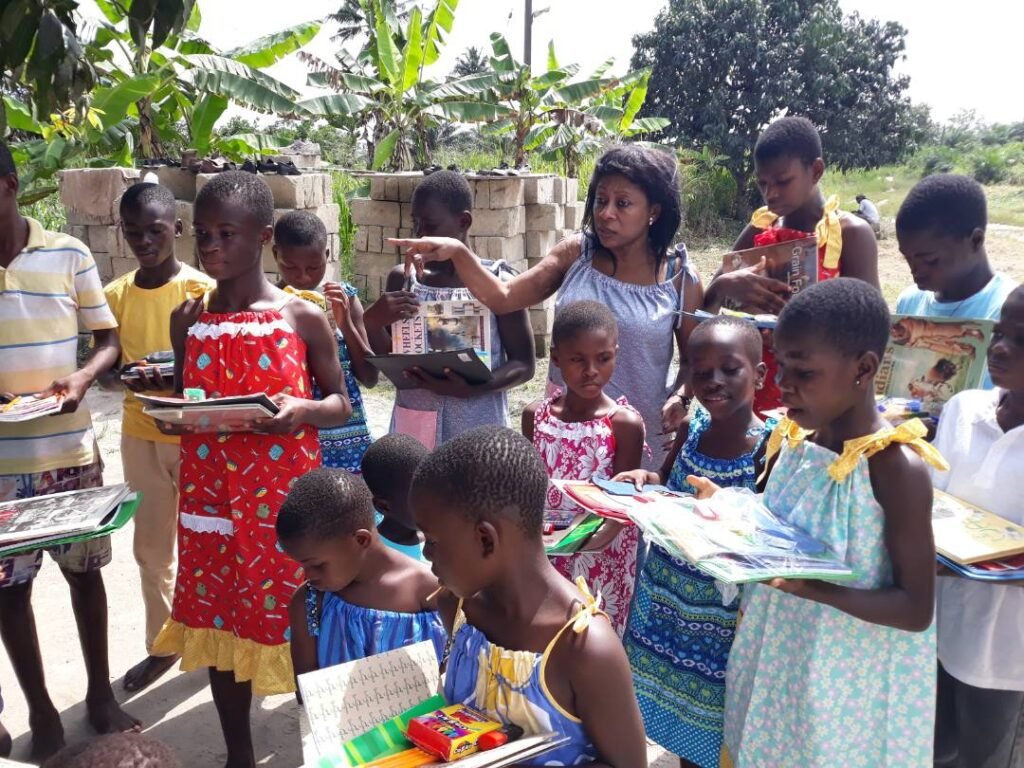 Home Kids being gifted with books and food